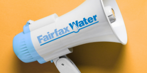 A blue and white megaphone with the Fairfax Water logo, placed on a yellow background.