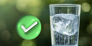 Glass of tap water with a check mark next to it