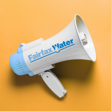 A blue and white megaphone with the Fairfax Water logo, placed on a yellow background.